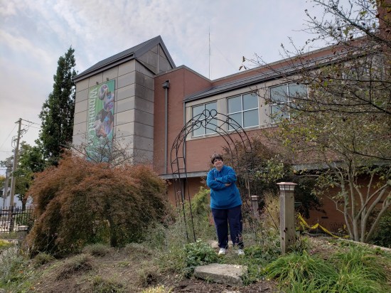 My wife standing atop a pile of dirt in Bloomington's WonderGarden