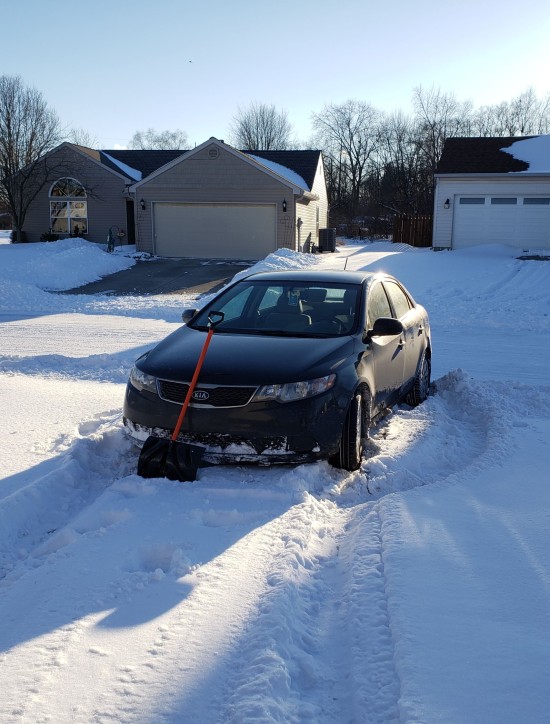 My car, stuck at the foot of our stupid driveway.