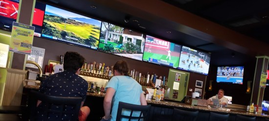 McGillicuddy's walls with TVs all around us, shot at a surreptitious Dutch angle because I was trying to be low-key about our touristy selves.
