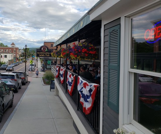 Sidelong shot of McGillicuddy's outdoor seating, all packed.