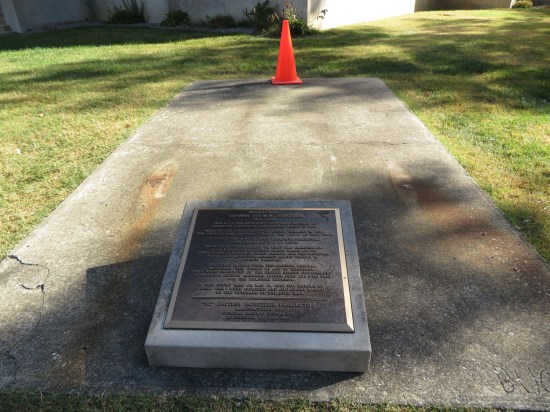Empty howitzer stand next to the courthouse.