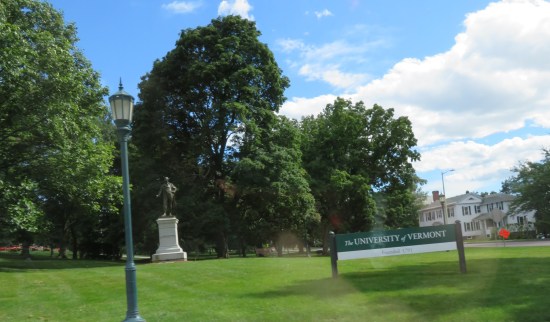 The University of Vermont lawn with a statue of the Marquis de Lafayette in the distance.