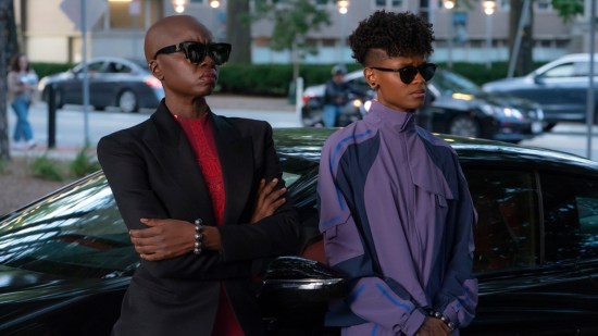Danai Gurira and Letitia Wright as Okoye and Shuri, wearing expensive non-superhero fashions to "blend in" with mixed results, from Marvel's "Black Panther: Wakanda Forever".