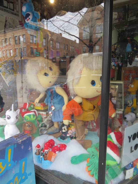 creepy giant Cabbage Patch Kids in a store window