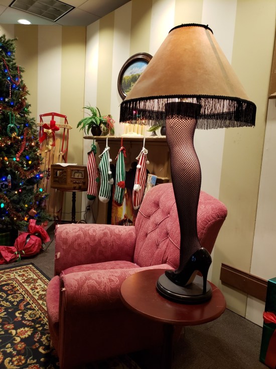 A Christmas Story leg lamp replica amid a display reprising Ralphie's living room.