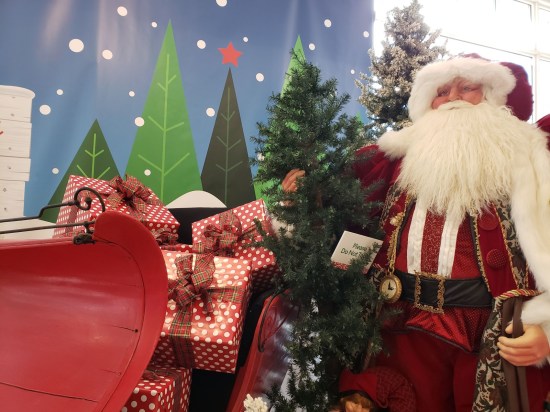 Santa Claus mannequin on sleigh.