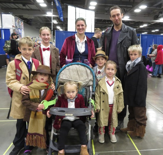 A family of nine, each cosplaying as a different Doctor from "Doctor Who".