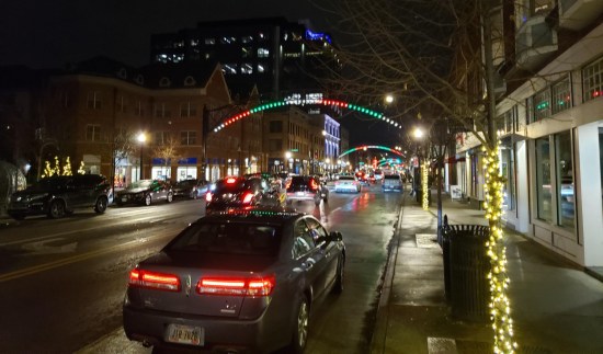 Short North Christmas arches on High Street at night.