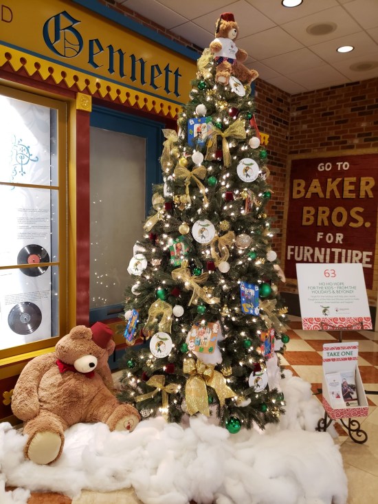 Christmas tree with teddy bears wearing red Shriner fezzes.