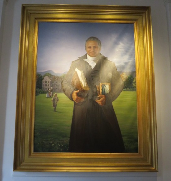 Painting: black scholar standing proudly on a university lawn, books in both arms.