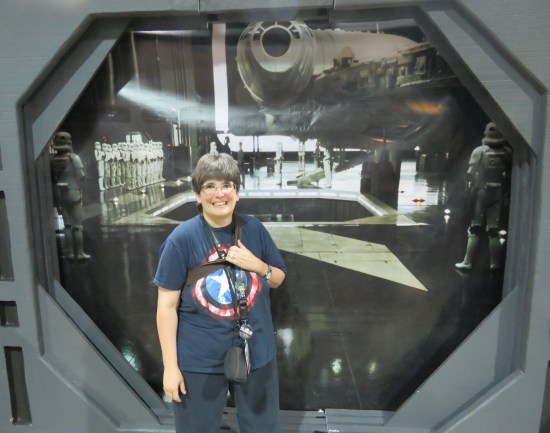 Anne in front of a Star Wars photo backdrop.