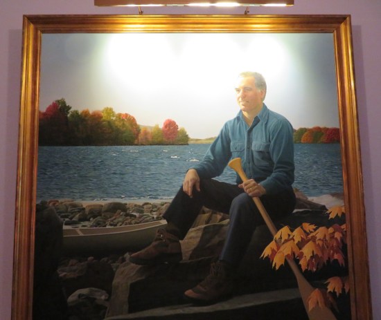 Painting: 60-year-old camping-trip guy in a rowboat in autumn, loosely holding one oar.