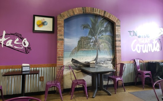 The dining room of The Tamale Place is all purple and tastefully decorated.