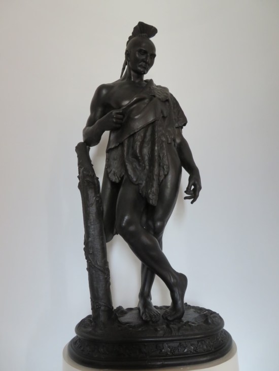 tiny bronze indigenous statue.