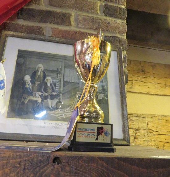 A small Indiana Bicentennial trophy presented to Corydon, apparently, sitting on a mantel.