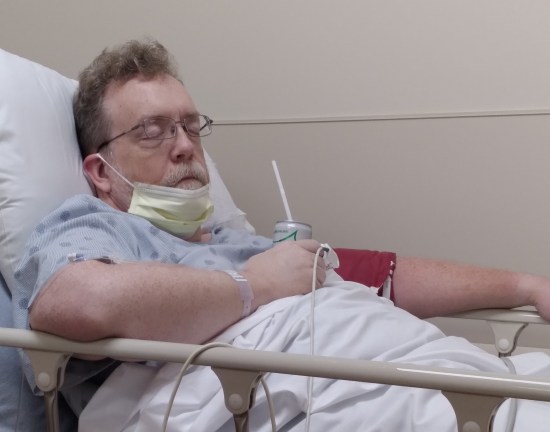 Me still in the stretcher, conked out, drink in hand, somehow not spilling.