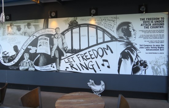 A black-and-white mural dedicated to racial equality and the John Lewis Voting Rights Advancement Act.