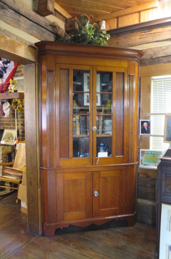 A well-polished wooden cabinet, older than it looks, doors shut.