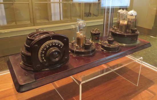 giant radio so weird that its assorted components weren't kept in a wooden box like most old-time radios. They're all sprawled out yet connected (and in a modern display case).