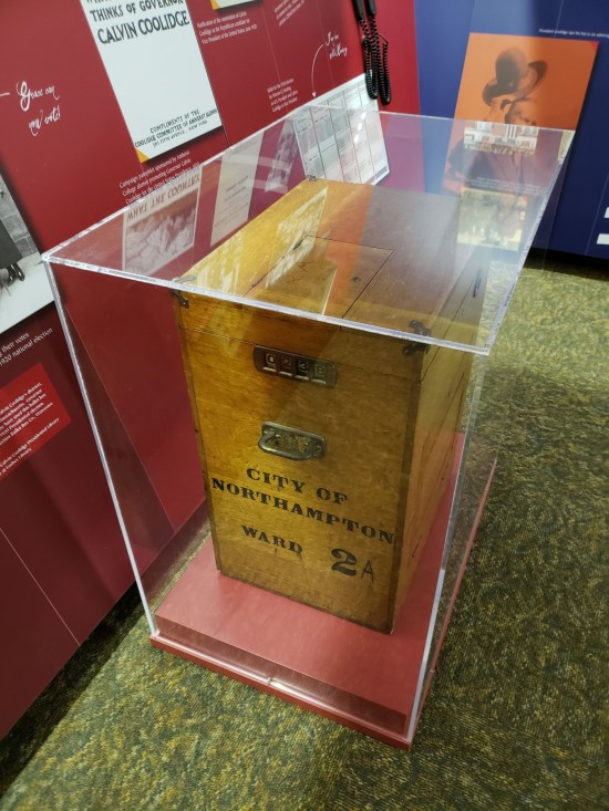 Big old ballot box, wood and about four feet tall, encased in glass.