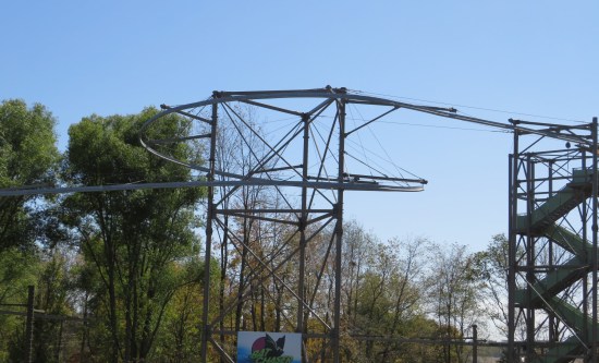 Roller coaster tracks against a blue sky, but not in service.