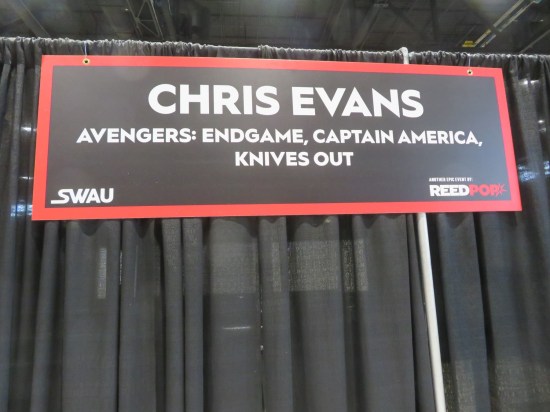 A sign above Chris Evans' autograph table.
