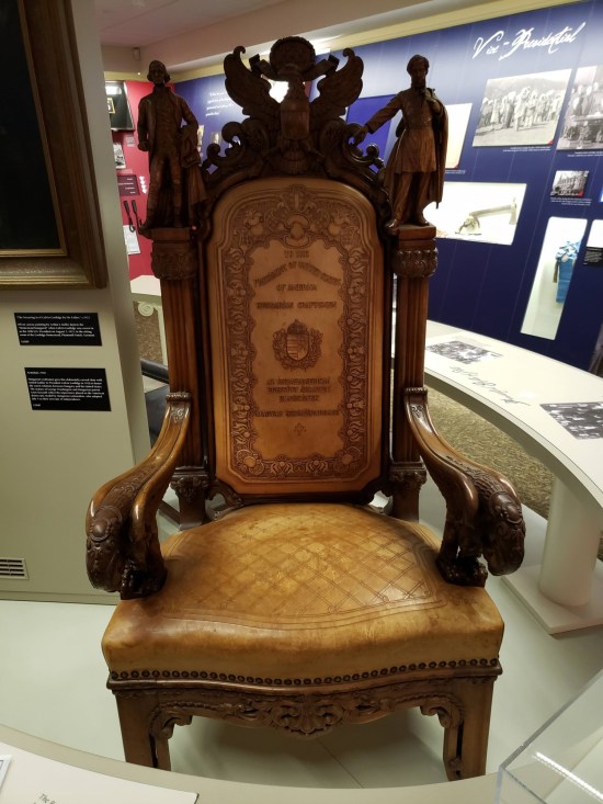 An intricately carved wooden chair. 