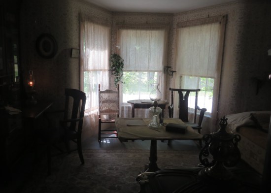 A darkened room with normal furniture, like a family room.