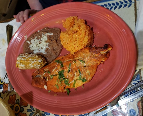 Well-seasoned snapper dinner served with street corn, refried beans and Mexican rice.