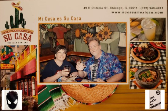 A scan of a poorly lit photo of Anne and me toasting. This quickie printout has a border around it with pics of their food.