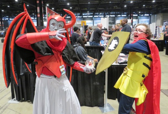 Venger and Eric cosplayers pretending to fight.