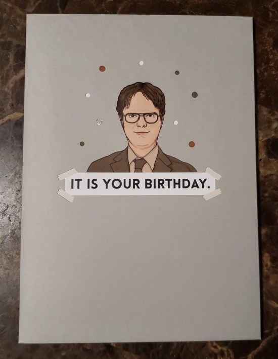 Gray birthday with a hand-drawn pic of a stern Dwight Schrute captioned, "It is your birthday."