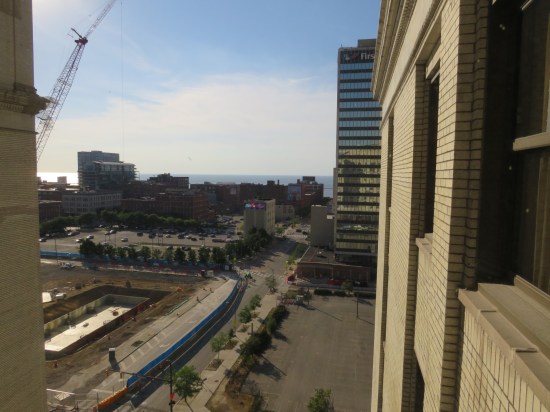 A window view of a construction site several stories down from us in downtown Cleveland. 
