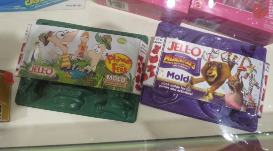 Boxes of modern cartoon character Jell-O molds.