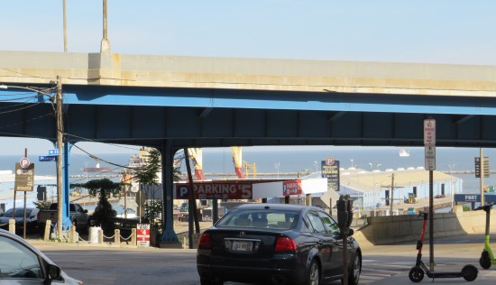 Random street scene with cars and an interstate bridge blocking our view of Lake Erie.