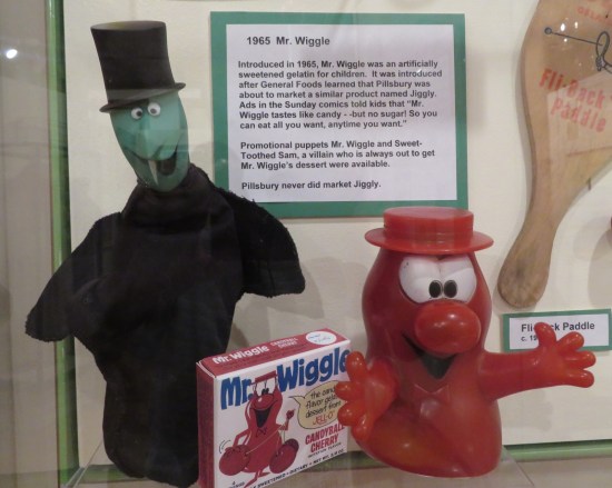 Two old puppets: one red and happy and goofy, the other a Snidely Whiplash ripoff.