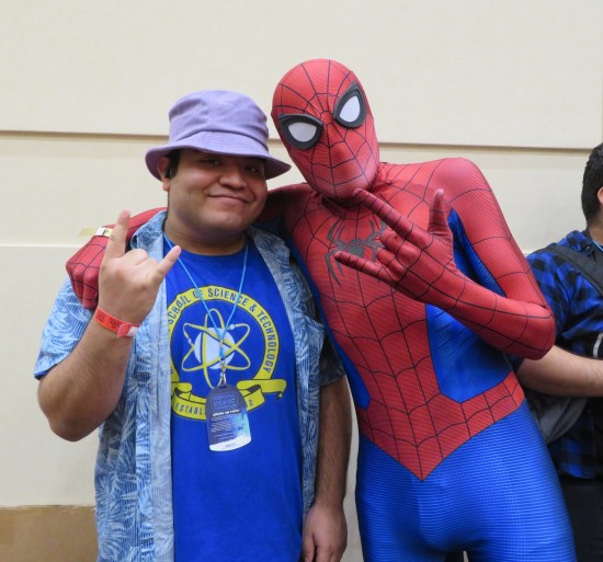 costumes: Spider-Man and Ned Leeds throwing metal hand-signs.
