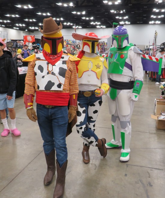 Three Mandalorian costumes styled like Woody, Jessie and Buzz from the "Toy Story" series.