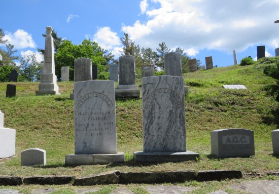 A row of 19th-century Coolidge family graves on a hill.