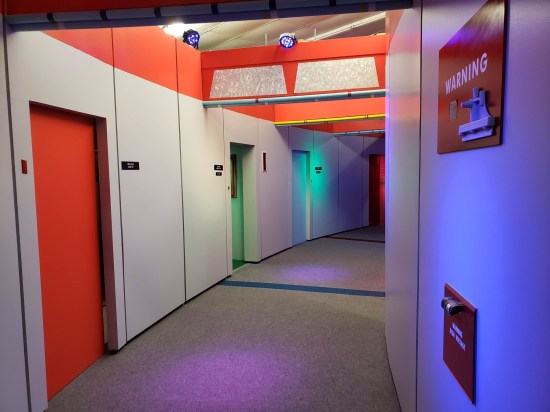 A recreated "Star Trek" hallway on the Enterprise, distinctively curved and with partly orange walls.
