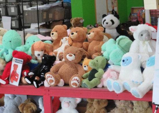 A teddy bear pile, all facing outward toward our tour group.