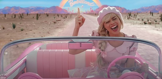 Margot Robbie as a happy Barbie in a  cute pink hat, driving away from Barbie-Land while singing along to Indigo Girls' "Closer to Fine" on the soundtrack.