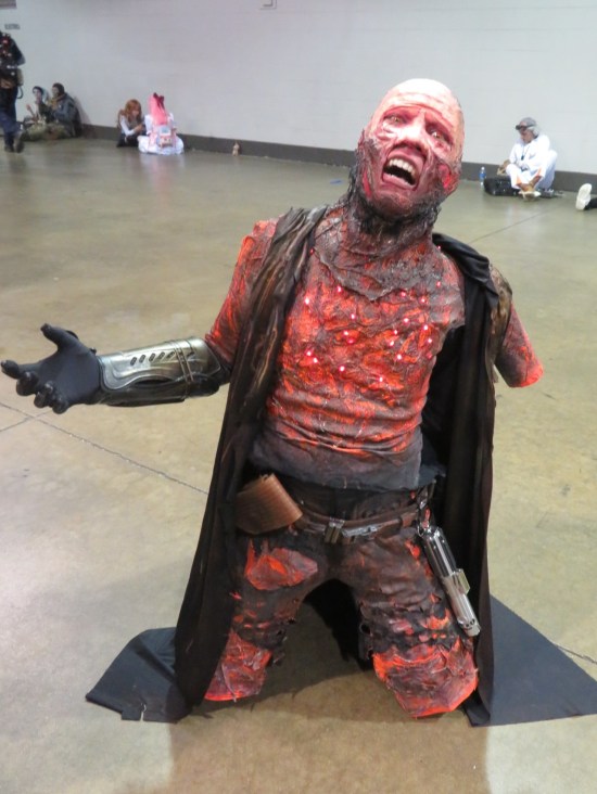 Anakin Skywalker at the end of "Revenge of the Sith", massively damaged by lava and missing his left arm.