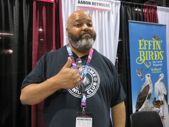 Anthony Ruttgaizer giving a thumbs-up at his table.