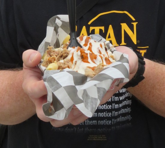 Me holding a serving of Buffalo Pork-n-Mac.