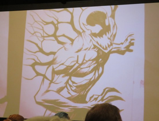 A Carnage sketch projected onto a large screen.