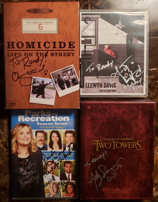 My newly autographed copies of "Inside Llewyn Davis", "The Two Towers", the final season of "Parks & Rec", and "Homicide: Life on the Street" season 6.