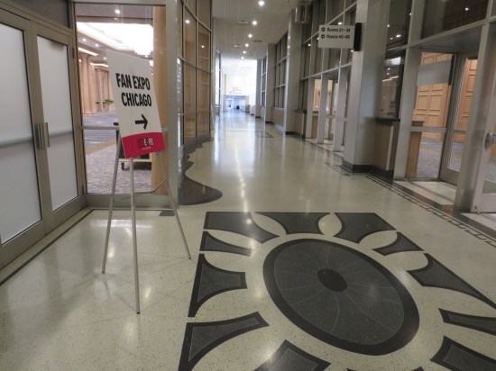 Fan Expo signage in an otherwise empty and cavernous convention center hallway.