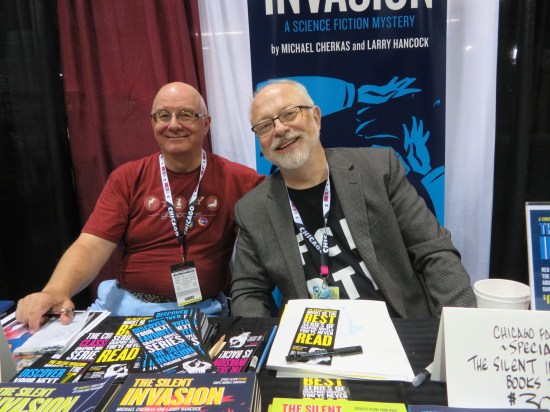 Michael Cherkas and Larry Hancock sharing a table.