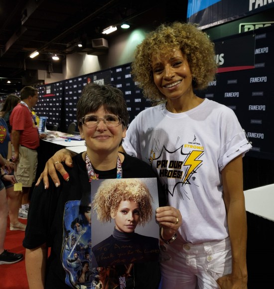 Anne standing next to Michelle Hurd, both smiling.